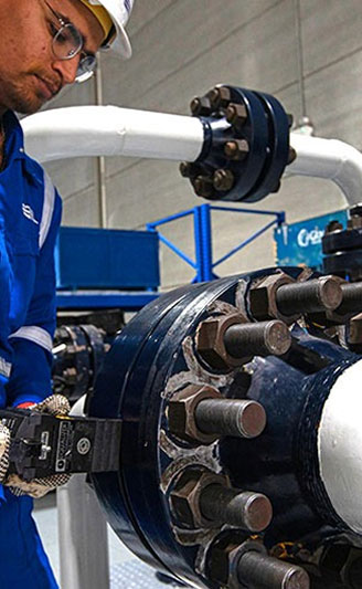 Technician working on industrial piping