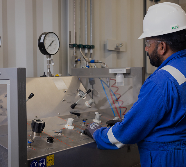 Technician servicing an industrial valve